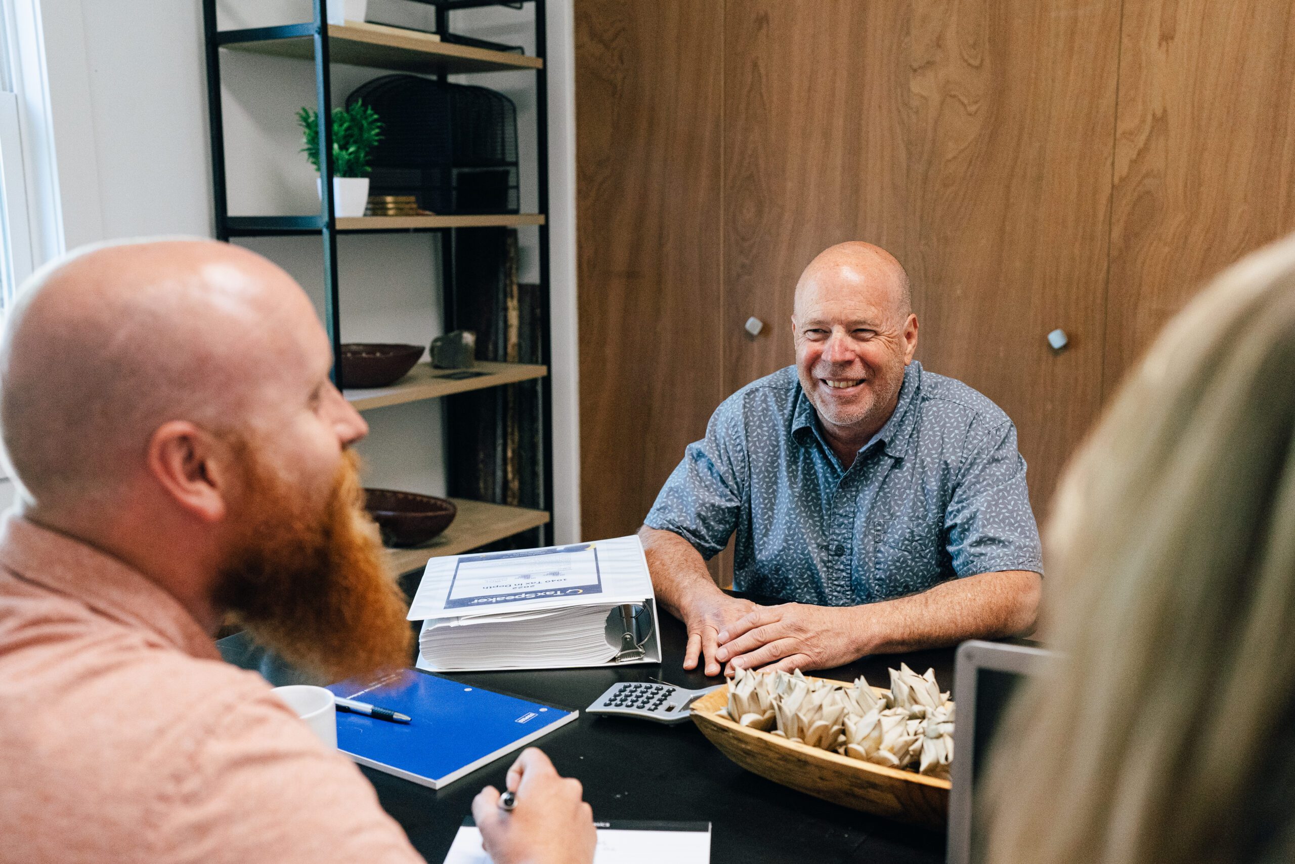 Fort Collins small business owner meeting with fractional CFO advisor at desk